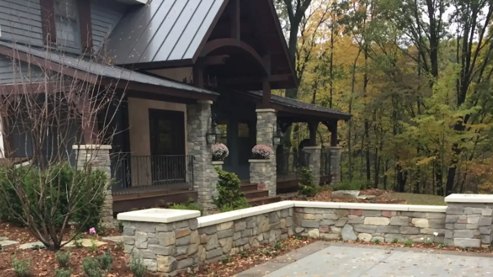 front yard landscape design ideas for Grand Rapids homes featuring a circular drive, structured planting, and balanced curb appeal